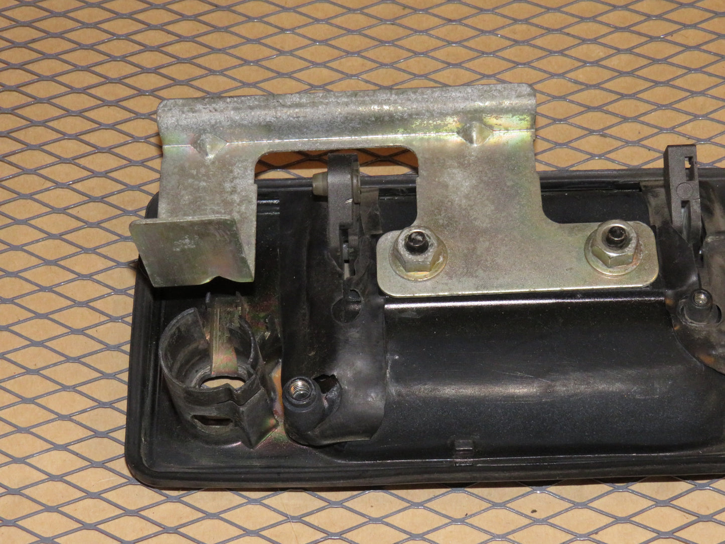 87 88 89 Nissan 300zx OEM Exterior Door Handle Mounting Bracket - Left