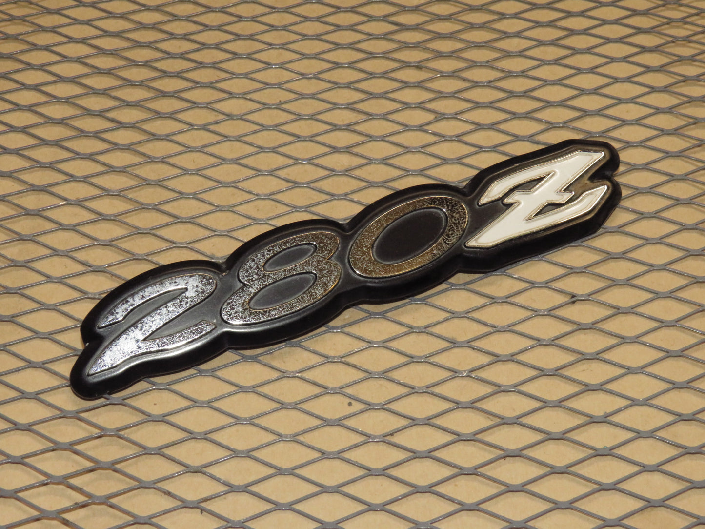 75 76 77 78 Datsun 280z OEM Trunk Emblem Badge