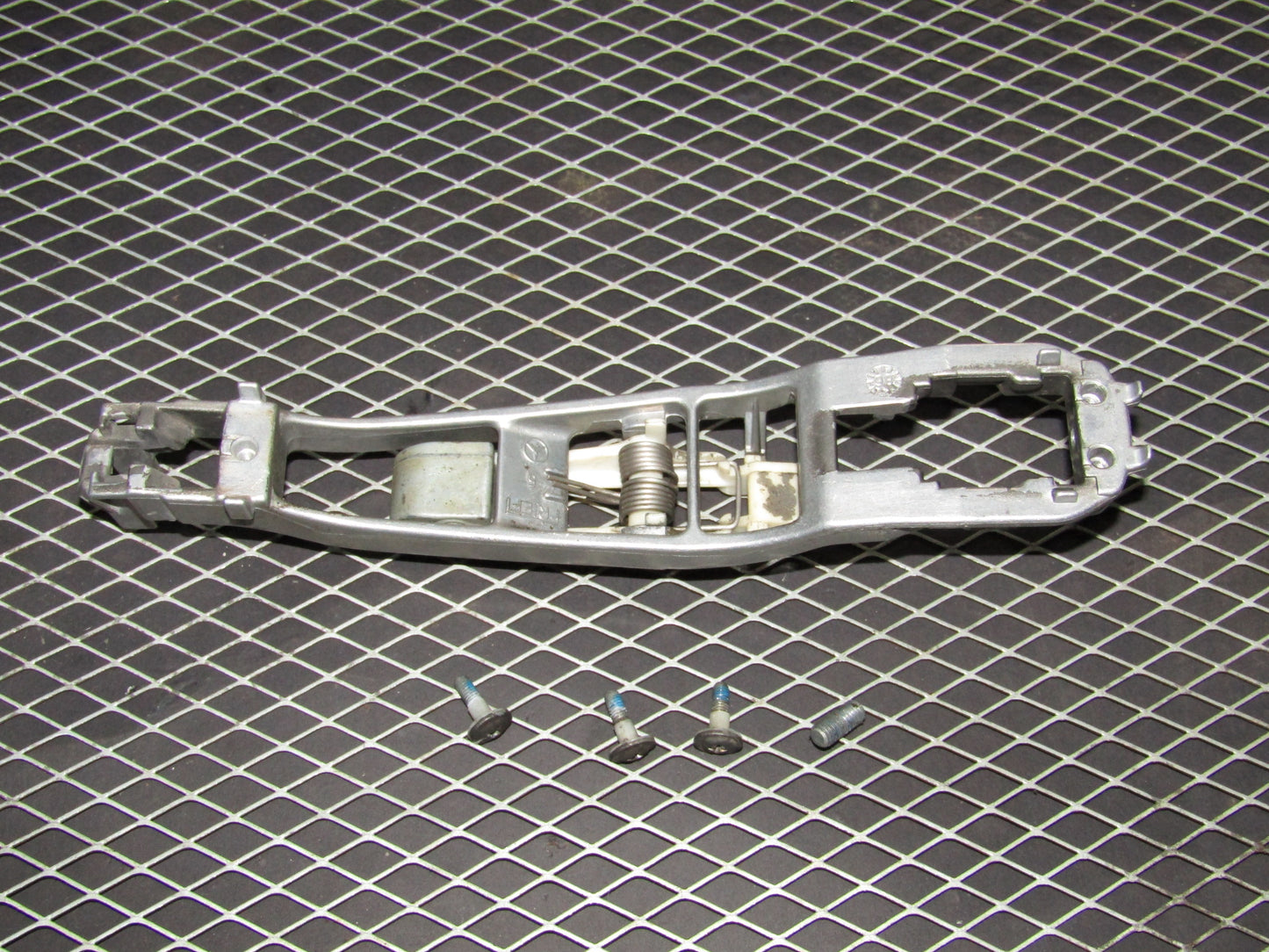 86-93 Mercedes Benz 300E OEM Front Exterior Door Handle Rear Mounting Bracket - Left