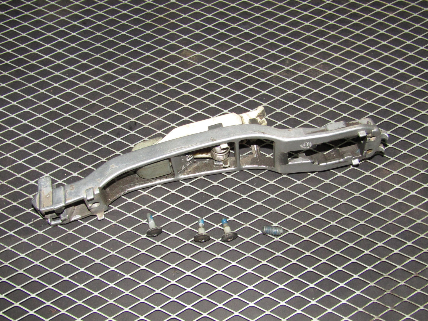 86-93 Mercedes Benz 300E OEM Rear Exterior Door Handle Mounting Bracket - Left