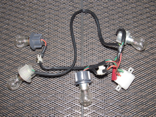 81-85 Mazda RX7 OEM Tail Light Bulb Socket - Left