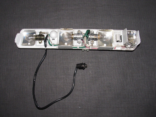 86 87 88 Toyota Supra OEM Tail Light Bulb Socket Panel - Left