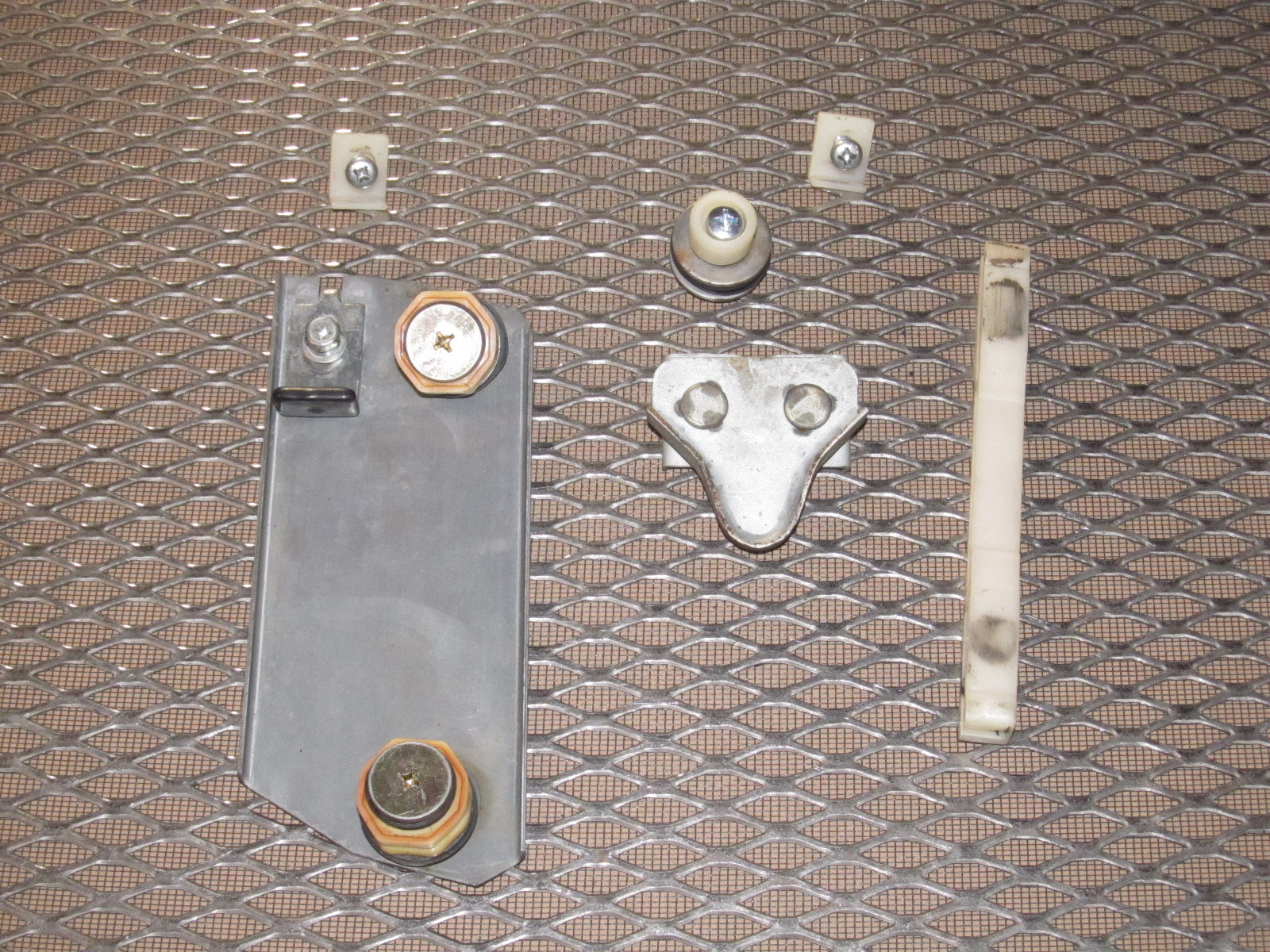 79 80 Datsun 280zx OEM Window Roller Stopper & Bracket - Left