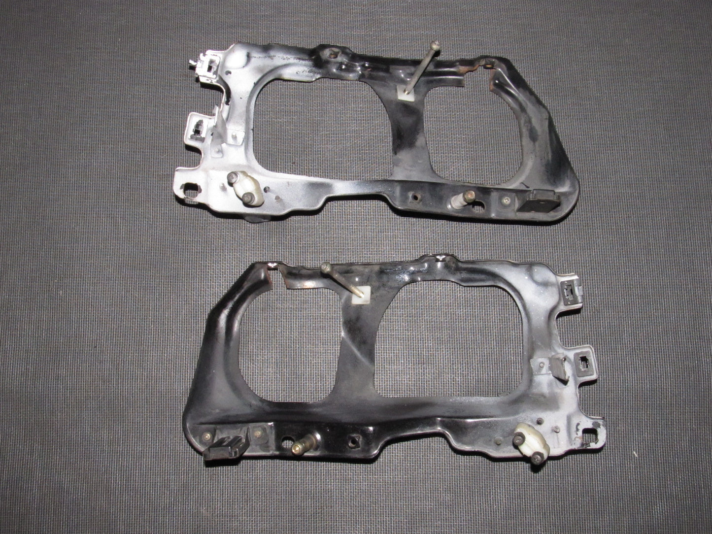 88 89 Honda CRX OEM D15B2 Headlight Mounting Bracket Set
