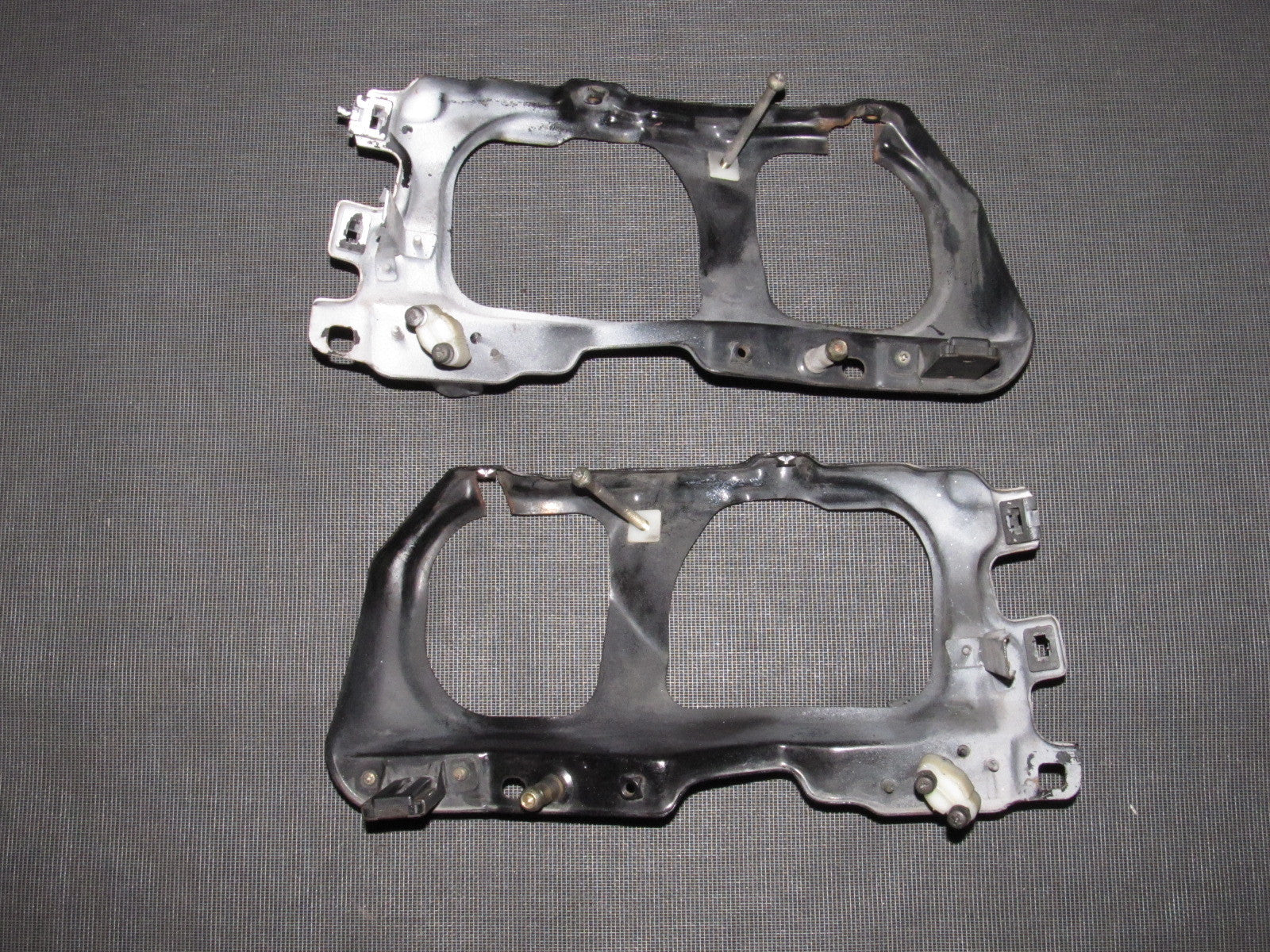 88 89 Honda CRX OEM D15B2 Headlight Mounting Bracket Set