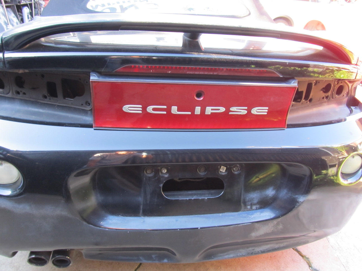 97 98 99 Mitsubishi Eclipse OEM Exterior Rear Center Deflector Reflector Panel