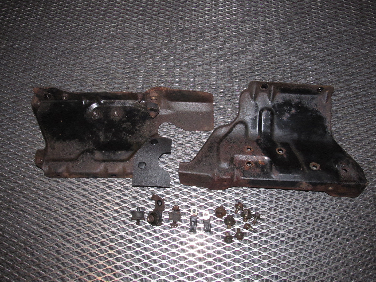 84 85 Mazda RX7 OEM A/C Condenser & Radiator Side Bracket Set