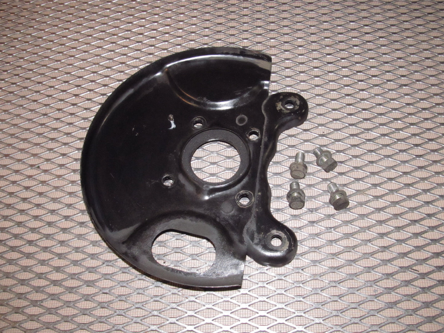 81-83 Mazda RX7 OEM Front Spindle Brake Dust Cover - Left