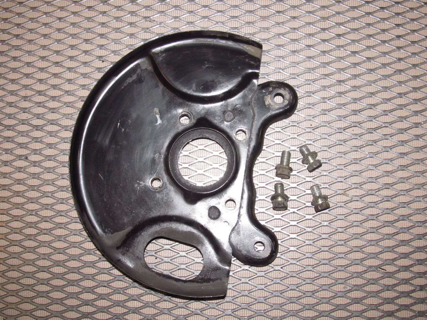 81-83 Mazda RX7 OEM Front Spindle Brake Dust Cover - Left