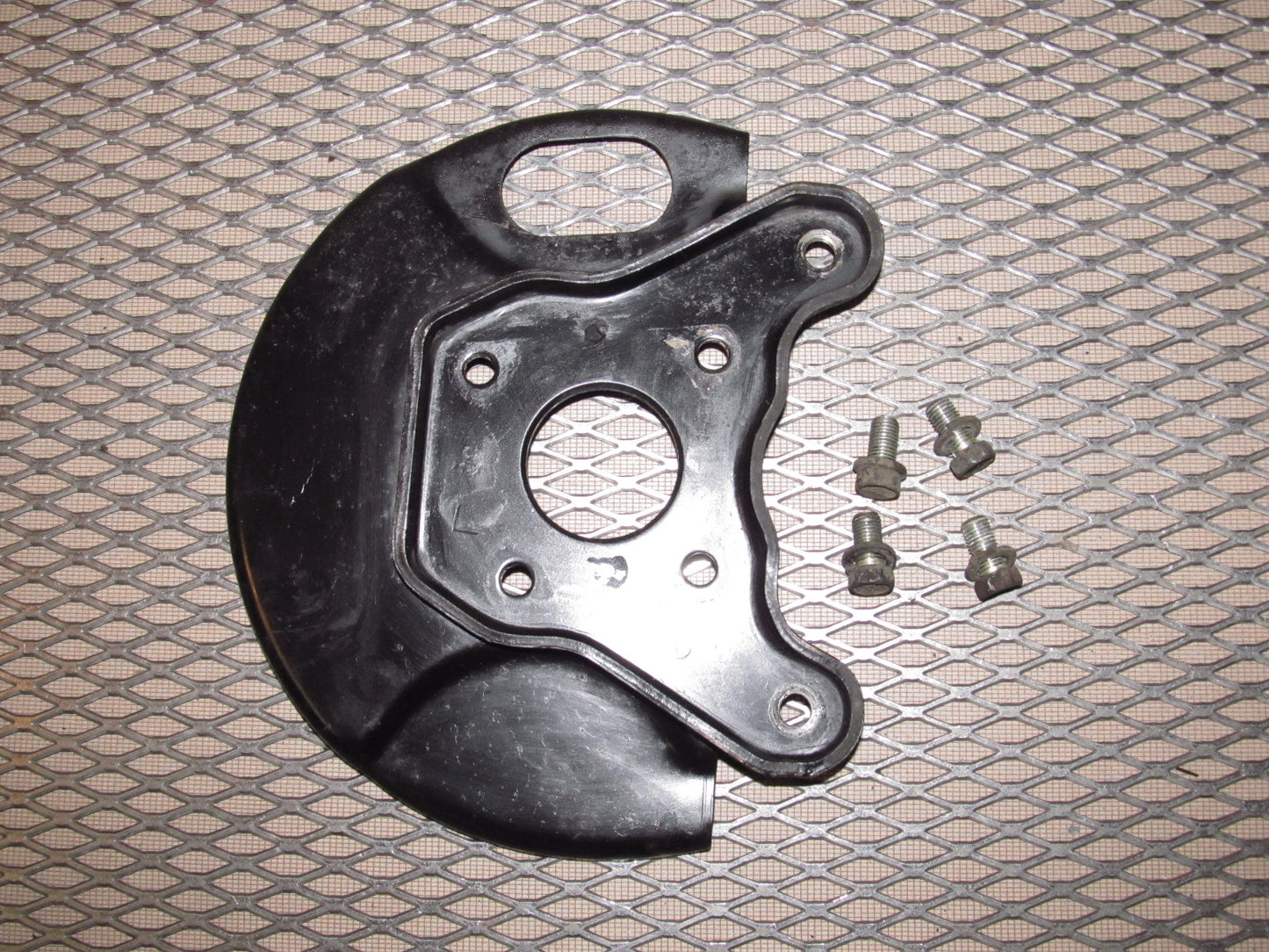 81-83 Mazda RX7 OEM Front Spindle Brake Dust Cover - Left