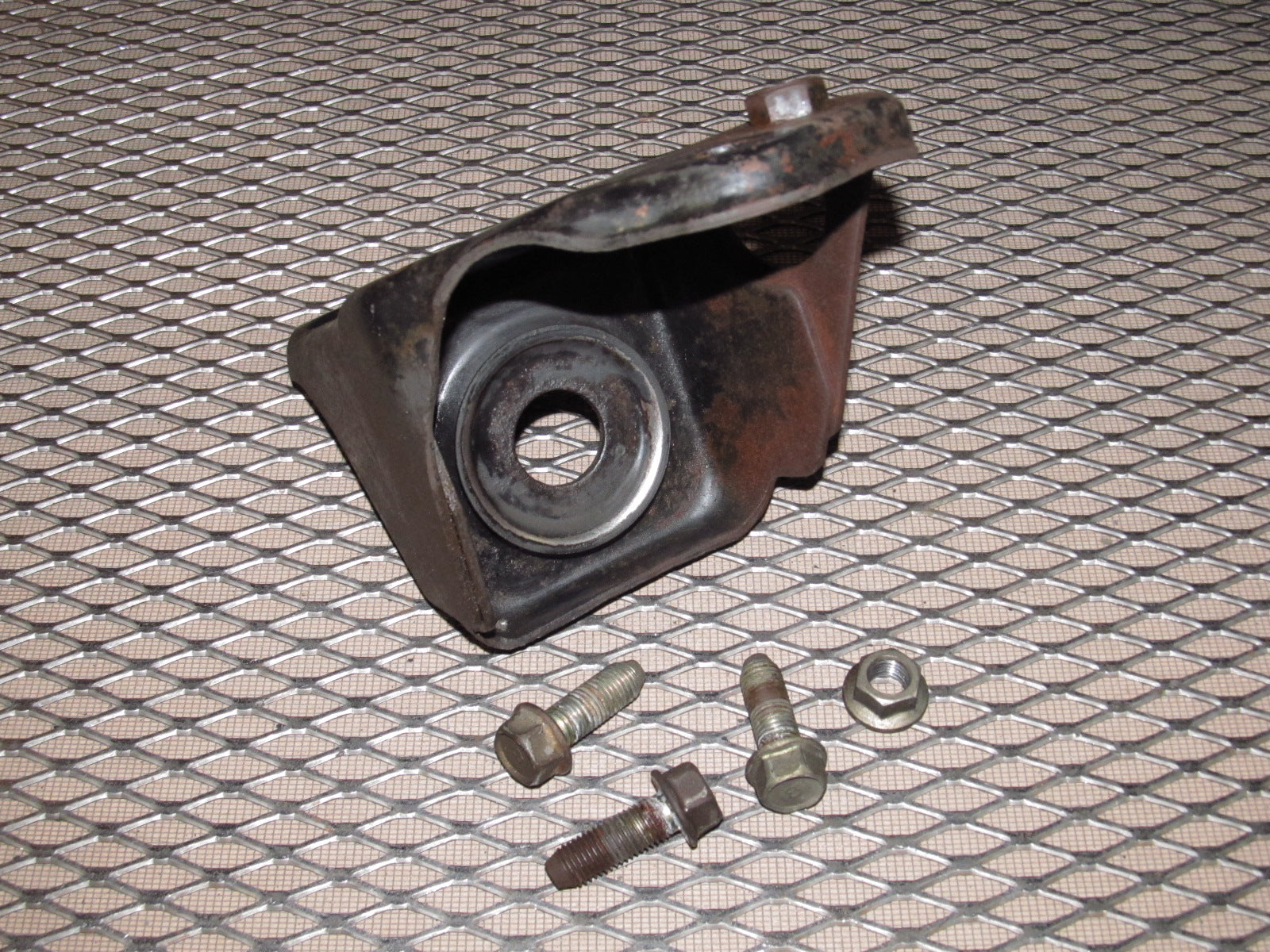 81-83 Mazda RX7 OEM Front Control Strut Rod Bracket - Left