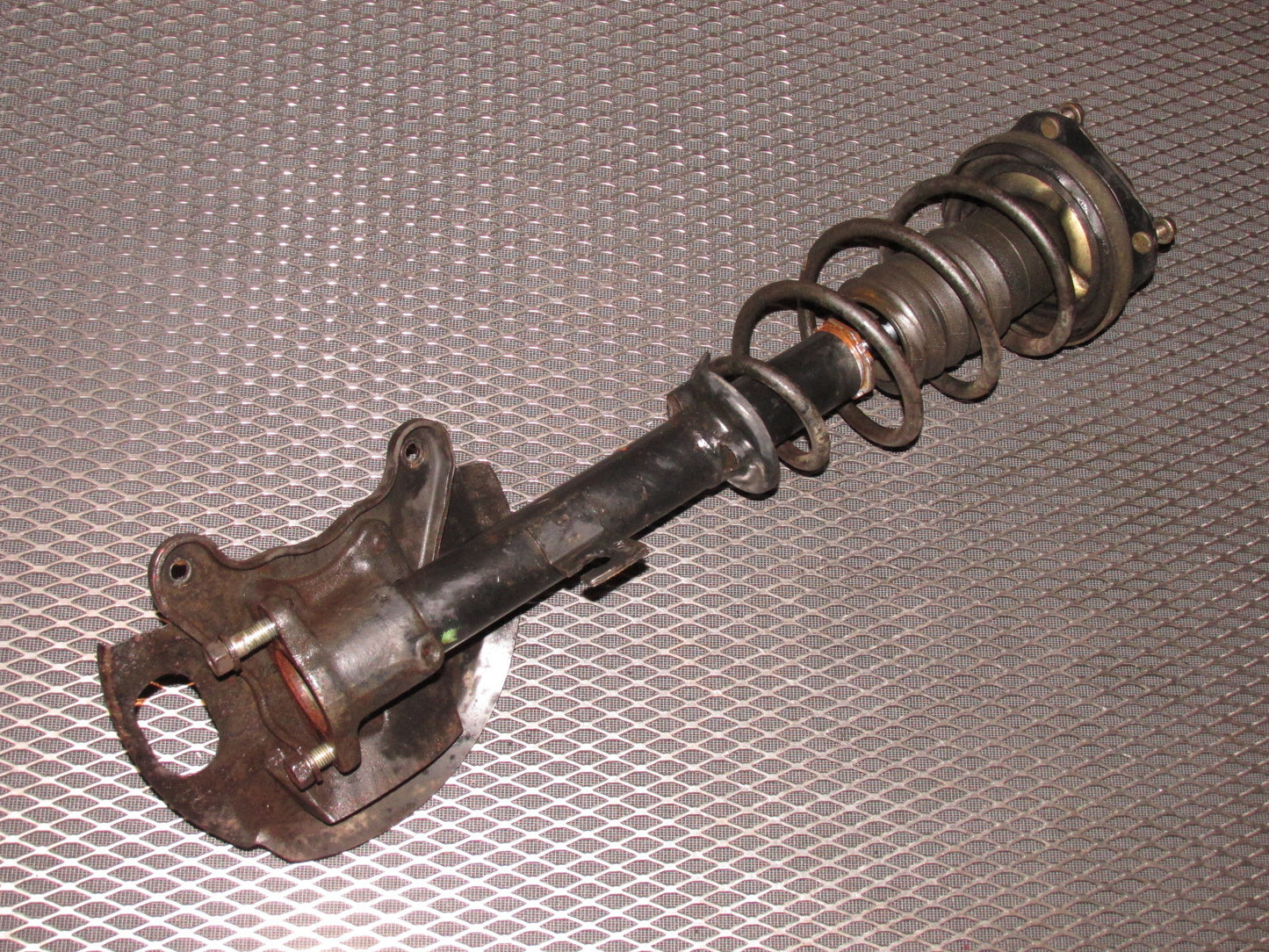 84 85 Mazda RX7 OEM 12A Front Wheel Spindle & Shock Assembly - Left