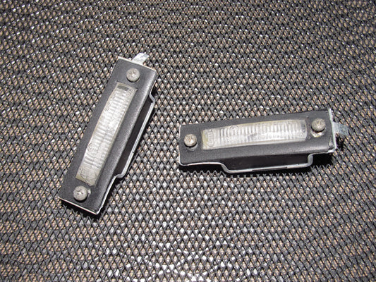 83-85 Porsche 944 OEM Rear License Plate Light - Set