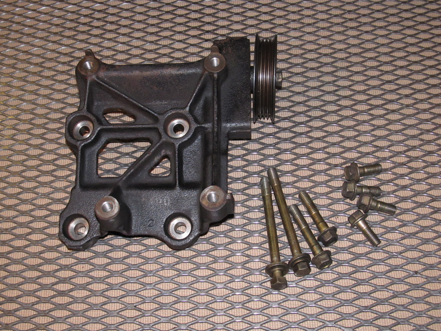 91 92 93 94 Nissan 240SX OEM A/C Compressor Mounting Bracket.