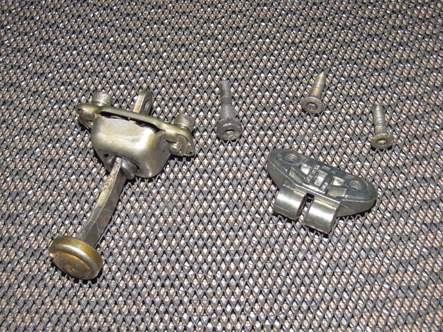 83-85 Porsche 944 OEM Door Check Stopper & Bracket - Left