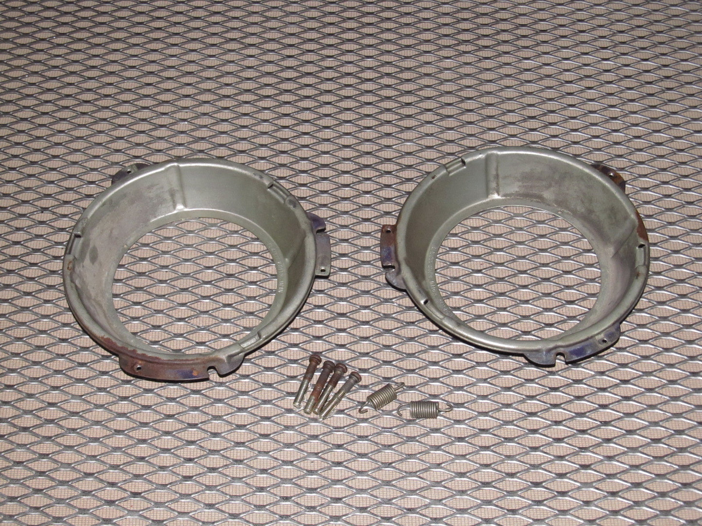 72 73 Datsun 240z OEM Headlight Mounting Bracket - Set