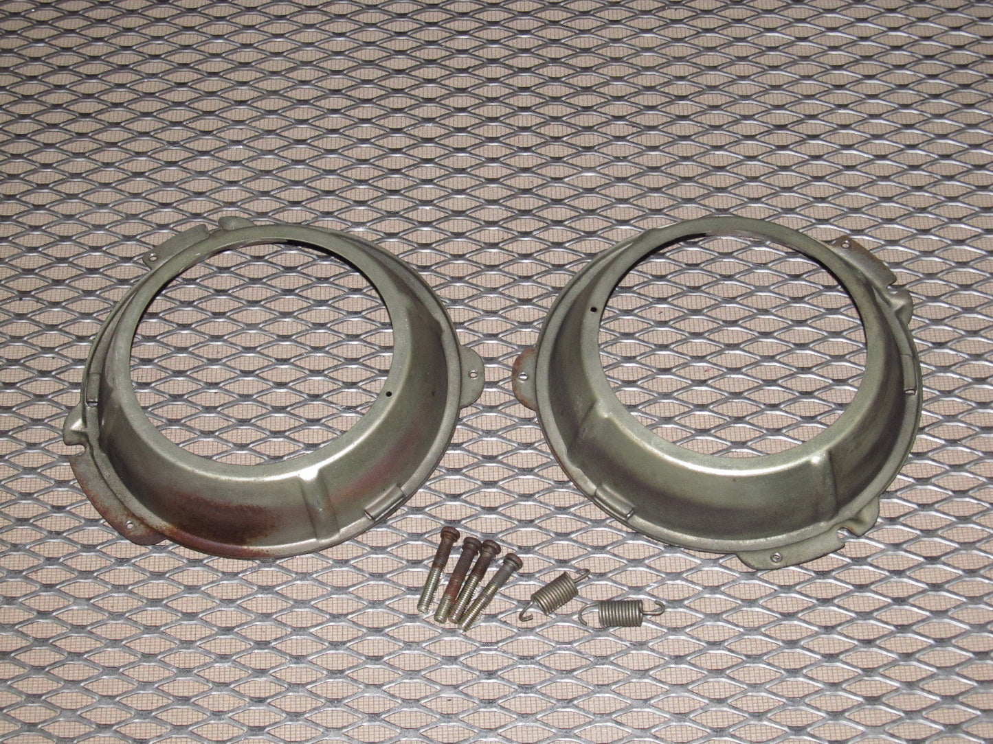 72 73 Datsun 240z OEM Headlight Mounting Bracket - Set