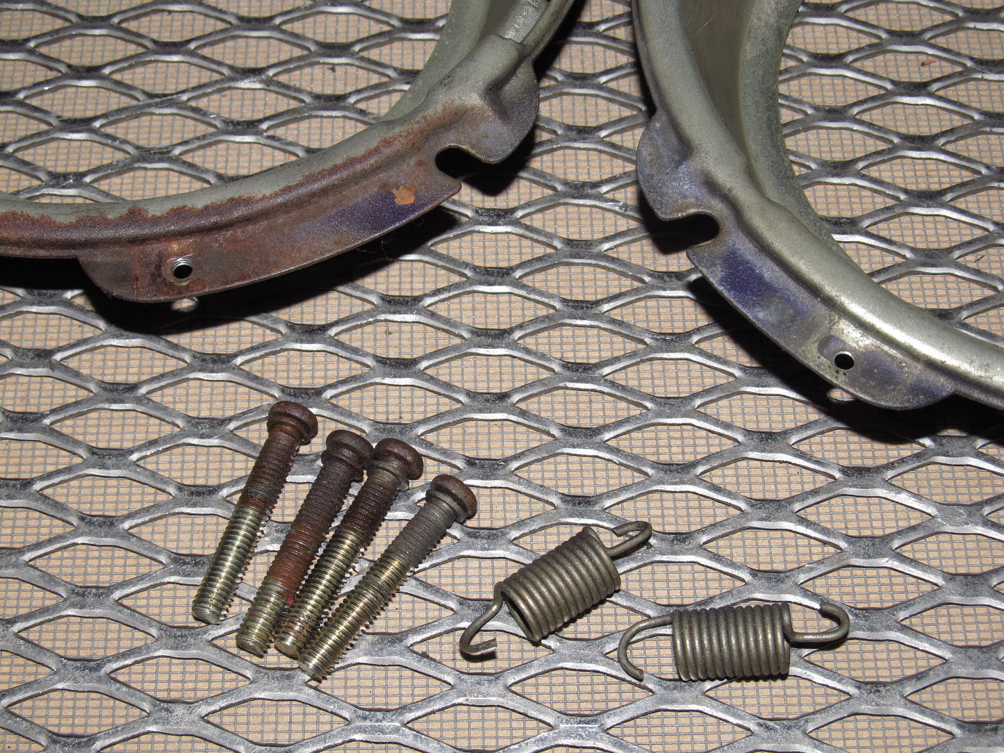 72 73 Datsun 240z OEM Headlight Mounting Bracket - Set