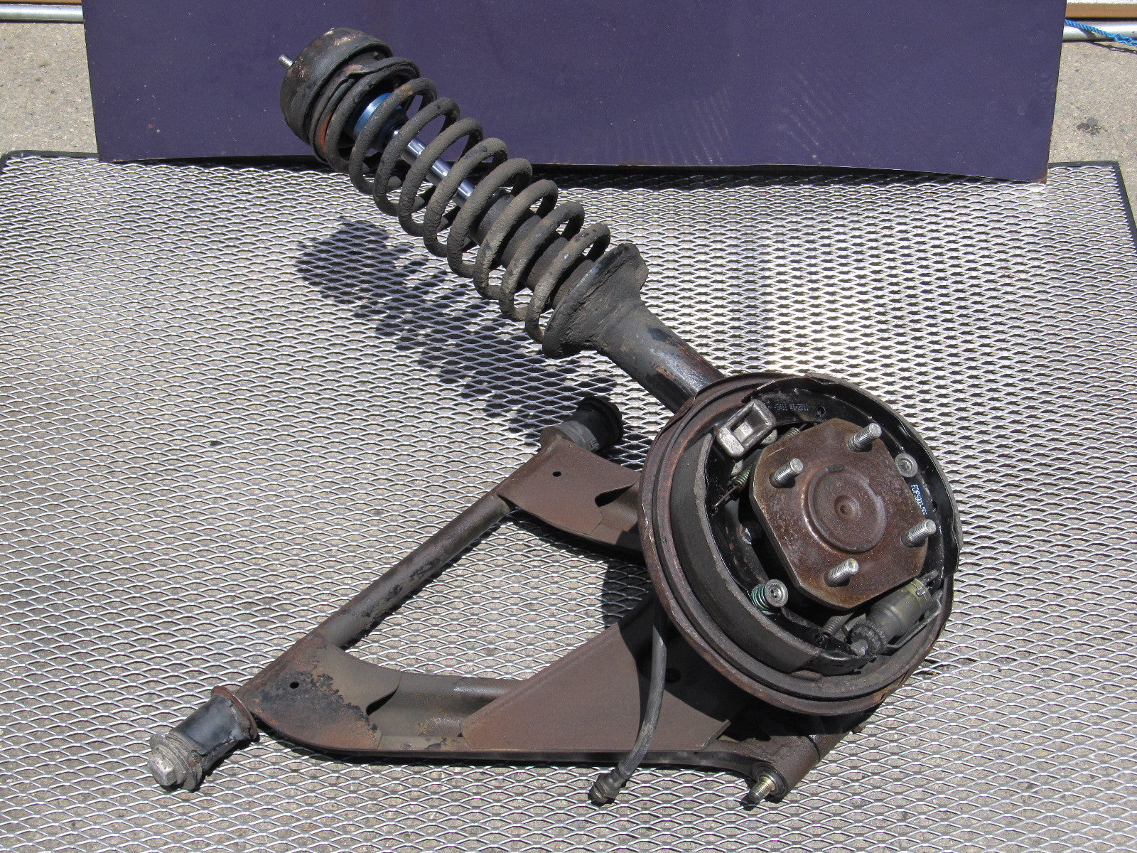 72 73 Datsun 240z OEM Rear Spindle & Control Arm Assembly - Left