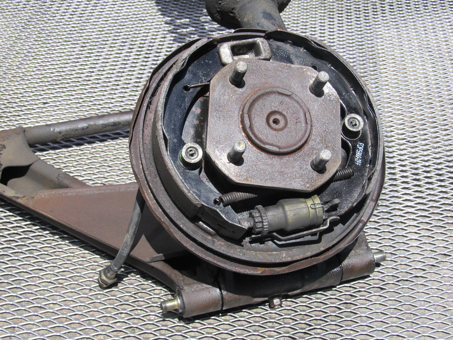 72 73 Datsun 240z OEM Rear Spindle & Control Arm Assembly - Left
