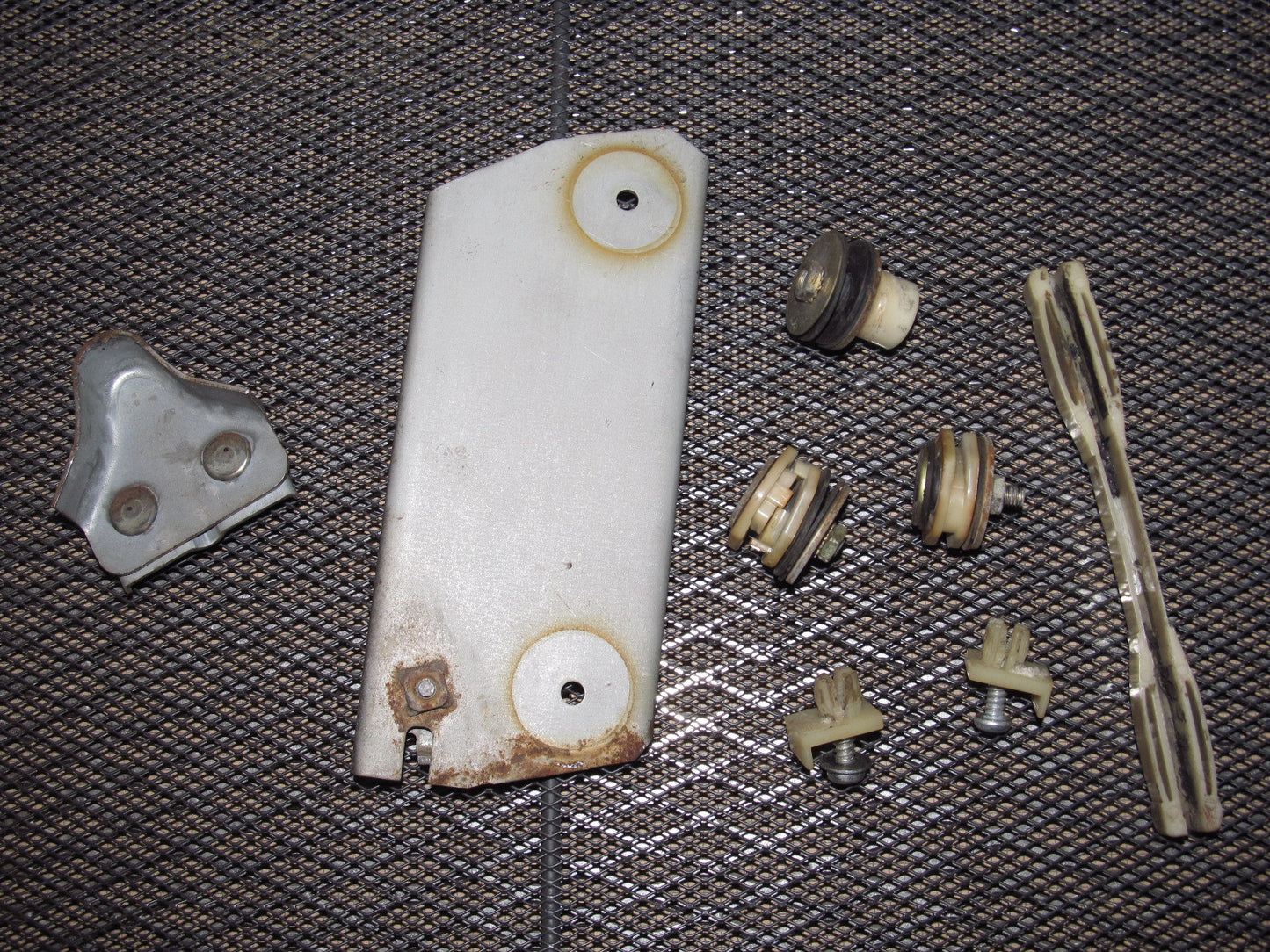 79 80 Datsun 280zx OEM Window Roller Stopper & Bracket - Left 2+0