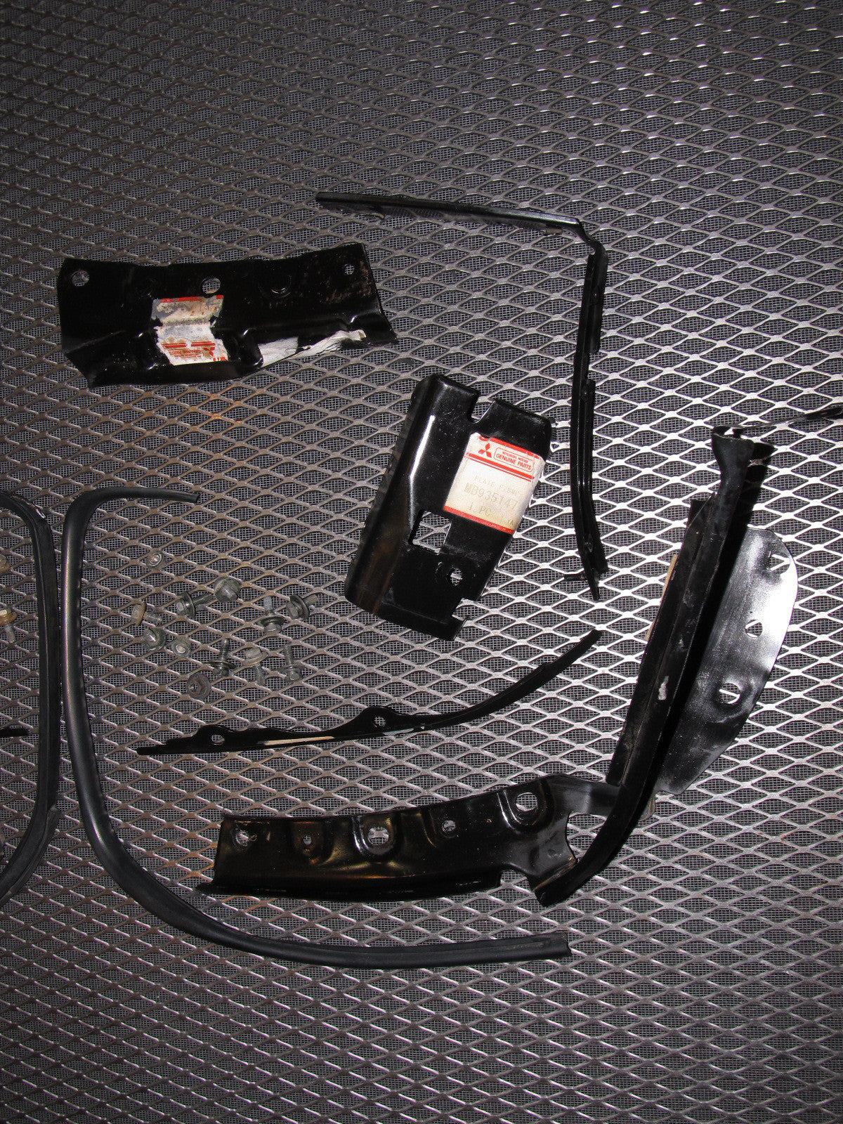 94 95 96 97 Mitsubishi 3000GT OEM Headlight & Bumper Bracket