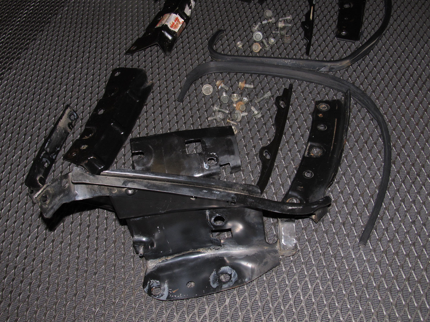 94 95 96 97 Mitsubishi 3000GT OEM Headlight & Bumper Bracket