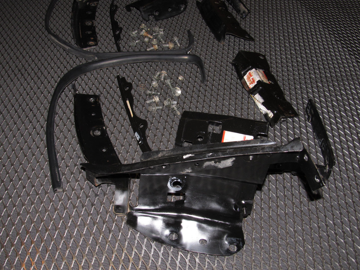 94 95 96 97 Mitsubishi 3000GT OEM Headlight & Bumper Bracket